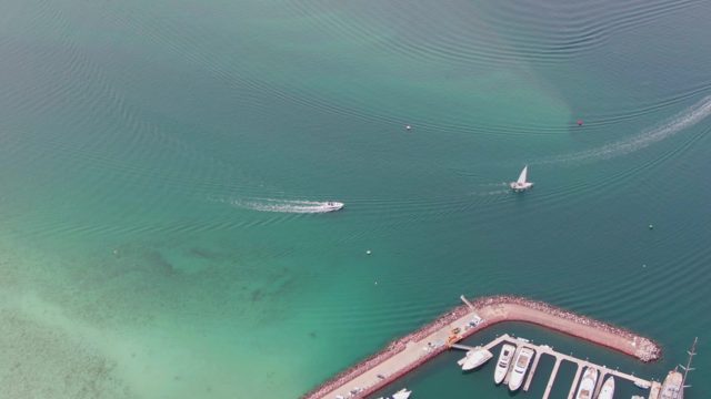 LA PAZ BCS-2023: Speedboat and Sailboat Moving in Clear Turquoise Water