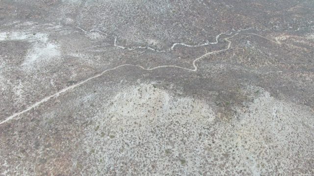 PUNTA GORDA BEACH BCS-2023: Vehicle Traveling on Winding Desert Road