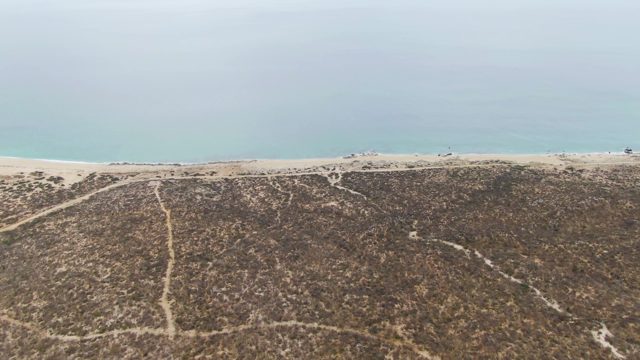 PUNTA GORDA BEACH BCS-2023: Beach Dunes with Vehicles Moving Along Shore