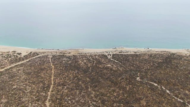 PUNTA GORDA BEACH BCS-2023: Vehicle Moving Along Sandy Beach by Coastal Dunes