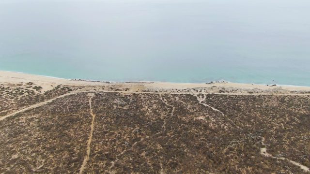 PUNTA GORDA BEACH BCS-2023: Beachgoers Walking Along Shoreline with Dunes