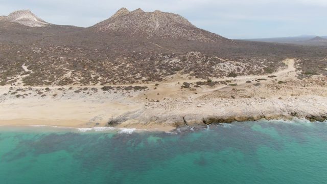 PUNTA GORDA BEACH BCS-2023: Sandy Beach and Rocky Coastline with Mountain Backdrop