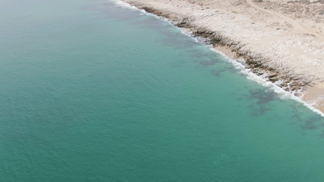 PUNTA GORDA BEACH BCS-2023: Coastal Shoreline with Turquoise Waters and Arid Terrain