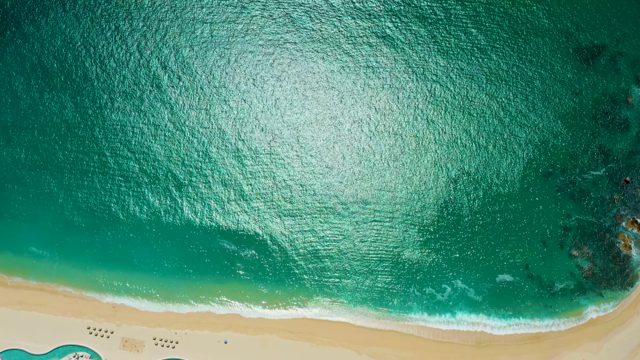 MARQUIS LOS CABOS MEXICO-2021: Gentle Ocean Waves Lapping at Sandy Beach