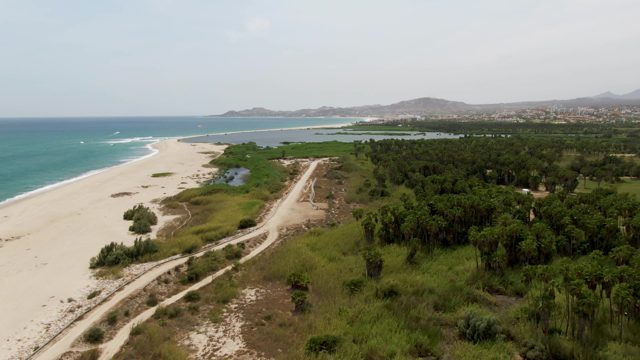 PUERTO LOS CABOS BEACH BCS-2023: Vehicle Traveling on Coastal Dirt Road
