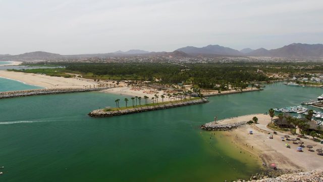 PUERTO LOS CABOS BEACH BCS-2023: Coastal Marina and Beach with Moving Boat