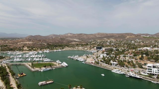 PUERTO LOS CABOS BEACH BCS-2023: Yachts Docked in a Calm Marina with Surrounding Hills
