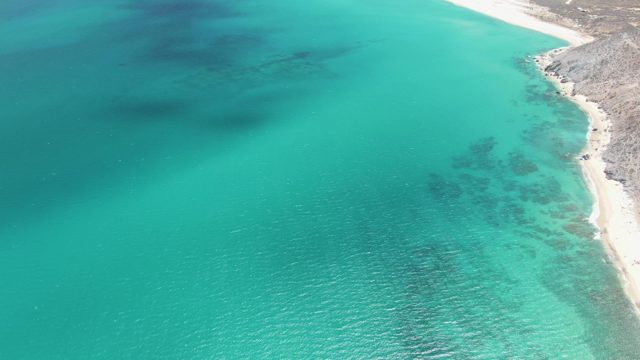 Clear Turquoise Ocean Shallows by Sandy Coast