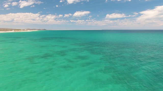 Gentle Ocean Waves by Sandy Shore