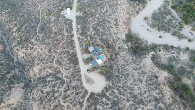 Vehicle Moving Along a Dry Hillside Road