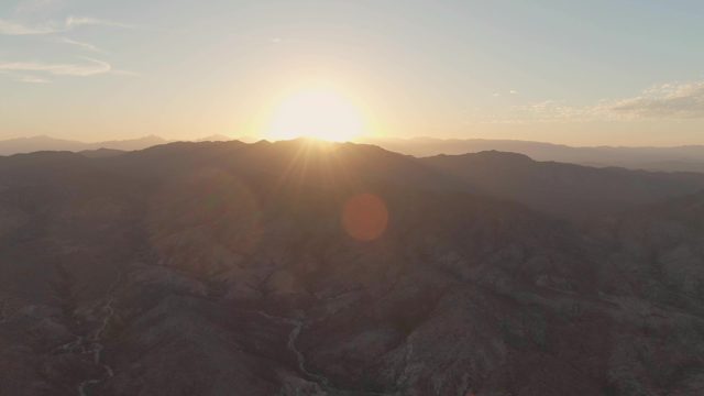 Sunset Over Mountain Valley and Winding River