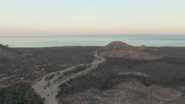 Winding Dirt Road Through Coastal Hills at Dawn