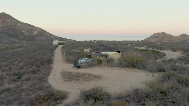 Desert Property with Building and Dirt Road