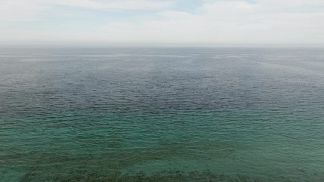 Clear Ocean Water Revealing Seabed and Coral
