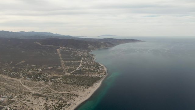 Coastal Town and Sandy Beach From Above