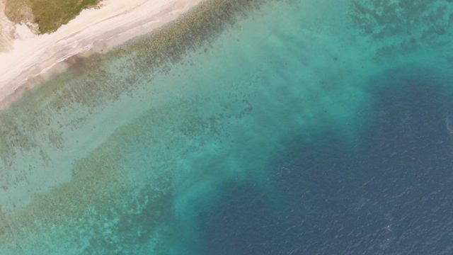Coastal Shoreline with Turquoise Waters and Sandy Beach
