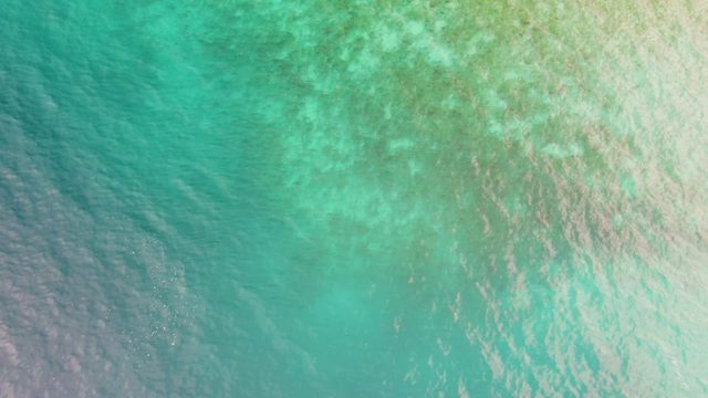Shallow Turquoise Water with Gentle Ripples and Color Variations