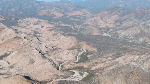 Winding River Through Arid Mountain Valleys