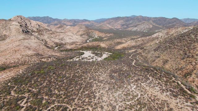 Desert Valley with Distant Mountain Ranges