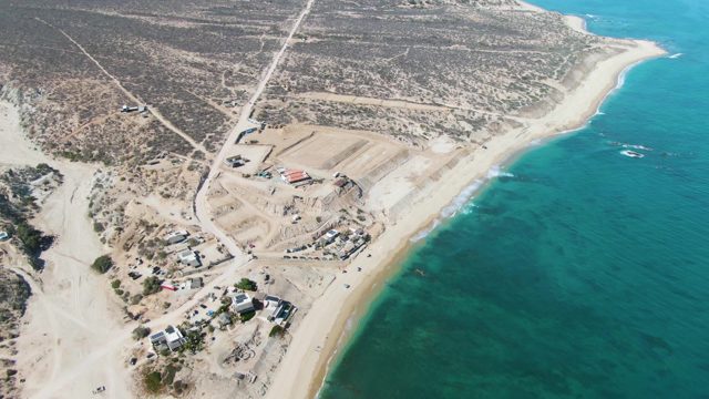 Beachside Construction Site with Vehicle Movement