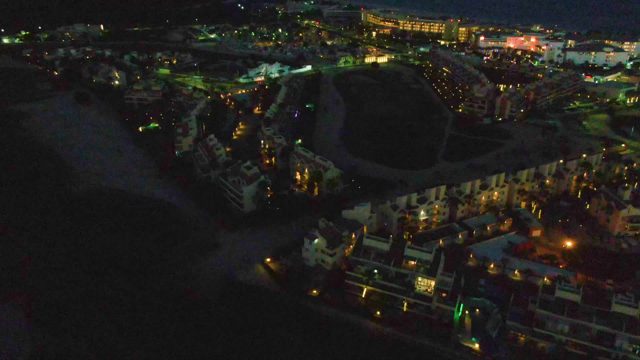Coastal Town Transitioning From Night to Dawn