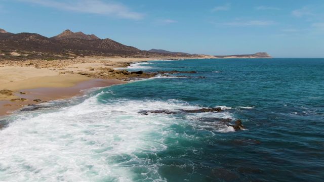 Waves Crashing on Rocky Beach Shoreline