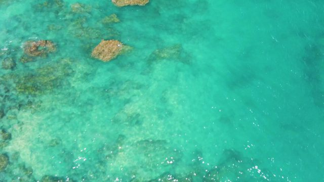 Clear Turquoise Water Over Underwater Rocks and Coral