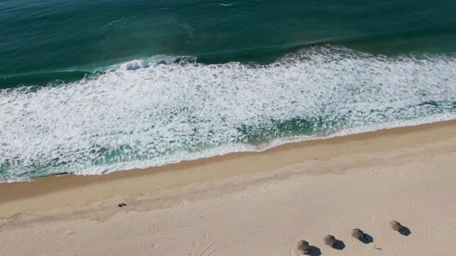 Sandy Beach with Advancing Ocean Waves