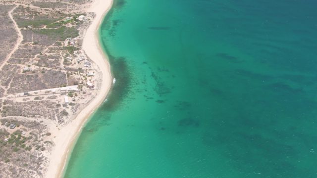 Coastal Shoreline with Turquoise Waters and Development