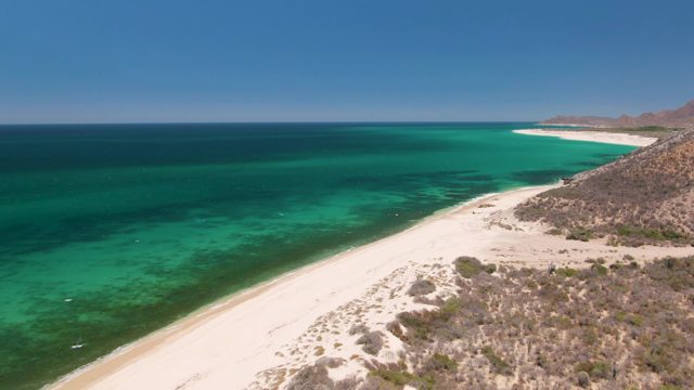 Coastal Shoreline with White Sand and Clear Turquoise Waters