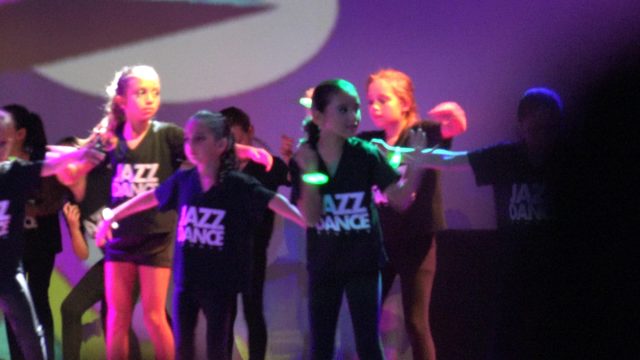 SAN JOSE DEL CABO BCS MEXICO-2023: Jazz Dance Group Performing on Stage with Purple Lighting