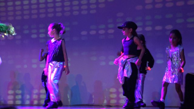 SAN JOSE DEL CABO BCS MEXICO-2023: Children Performing a Dance Routine on a Lit Stage