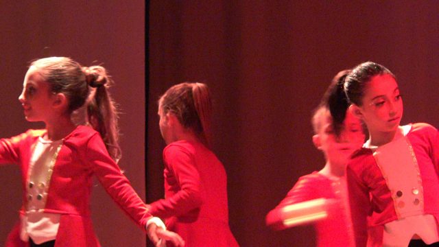 SAN JOSE DEL CABO BCS MEXICO-2023: Young Girls in Red Outfits Perform Stage Dance Routine