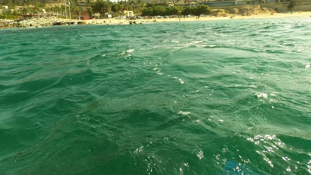 LOS BARIELLES BCS MEXICO-2023: Person Swimming in Turquoise Ocean Waters