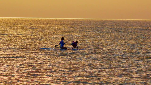 EL SARGENTO LA VENTANA MEXICO-2020: Two People Paddleboarding on the Ocean at Sunset