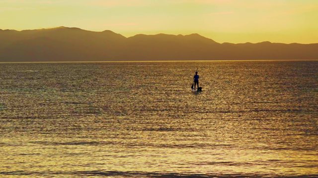 EL SARGENTO LA VENTANA MEXICO-2020: Paddleboarder Gliding on Calm Ocean at Sunset