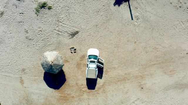 JUNCALITO BCS MEXICO-2020: Car Trunk Closing Near Beach Umbrella From Above