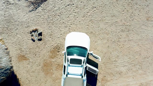 JUNCALITO BCS MEXICO-2020: Person Moving on Sand Near Open-Door Car