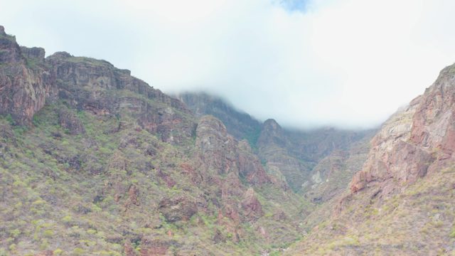 PUERTO ESCONDIDO BCS MEXICO-2020: Mountain Valley with Misty Clouds and Rocky Slopes