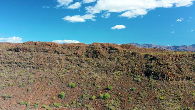 SAN JAVIER BCS MEXICO-2020: Desert Landscape with Red Rock Formations and Sparse Shrubs