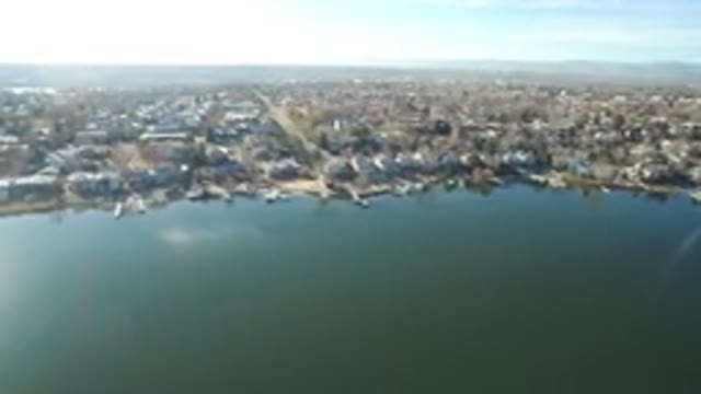 WESTMINSTER COLORADO-2016: Drone Footage Over Lake with Sun Reflecting Off Water