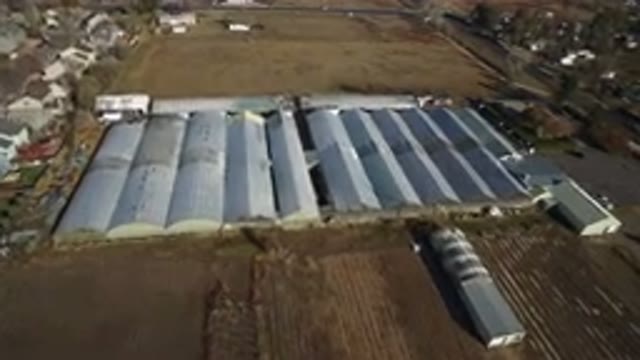WESTMINSTER COLORADO-2016: A Row Of Very Large Buildings With Fields On Either Side