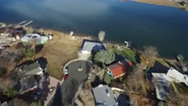 WESTMINSTER COLORADO-2016: Top View Of A City With Many Houses And A Lake Beside