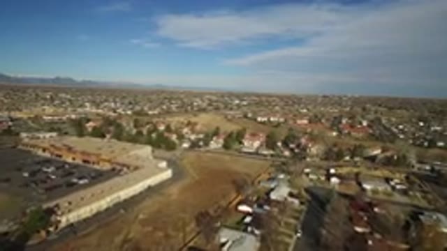 WESTMINSTER COLORADO-2016: Blue Sky Mountains in the Background with Yellowish Vegetation