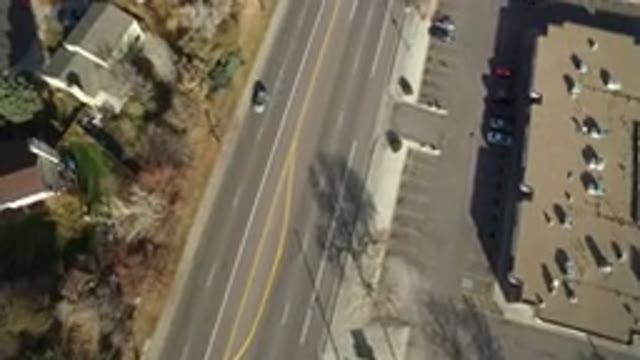 WESTMINSTER COLORADO-2016: Vehicles Driving On A Divided Highway Past Houses And