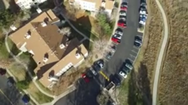 WESTMINSTER COLORADO-2016: Rooftops Cars Lined Up On A Street Clear Sky Day