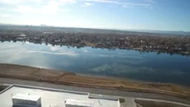 WESTMINSTER COLORADO-2016: Video Footage Of A Medium Size Lake With Land All