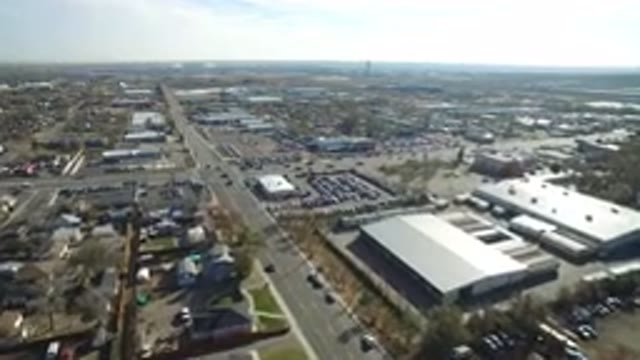 WESTMINSTER COLORADO-2016: A Top View Of A City With Buildings Roads Cars Trees