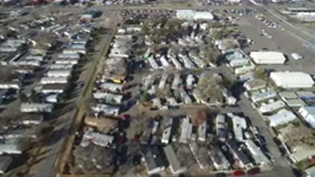 WESTMINSTER COLORADO-2016: An Open Area Filled With Trailers Buildings Roads And Cars