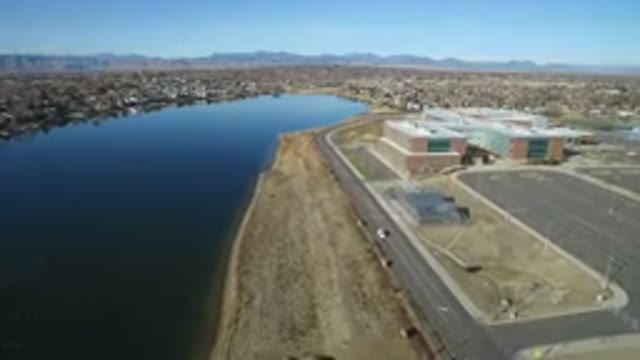 WESTMINSTER COLORADO-2016: Moving Aerial View Of Building And Road Next To A River